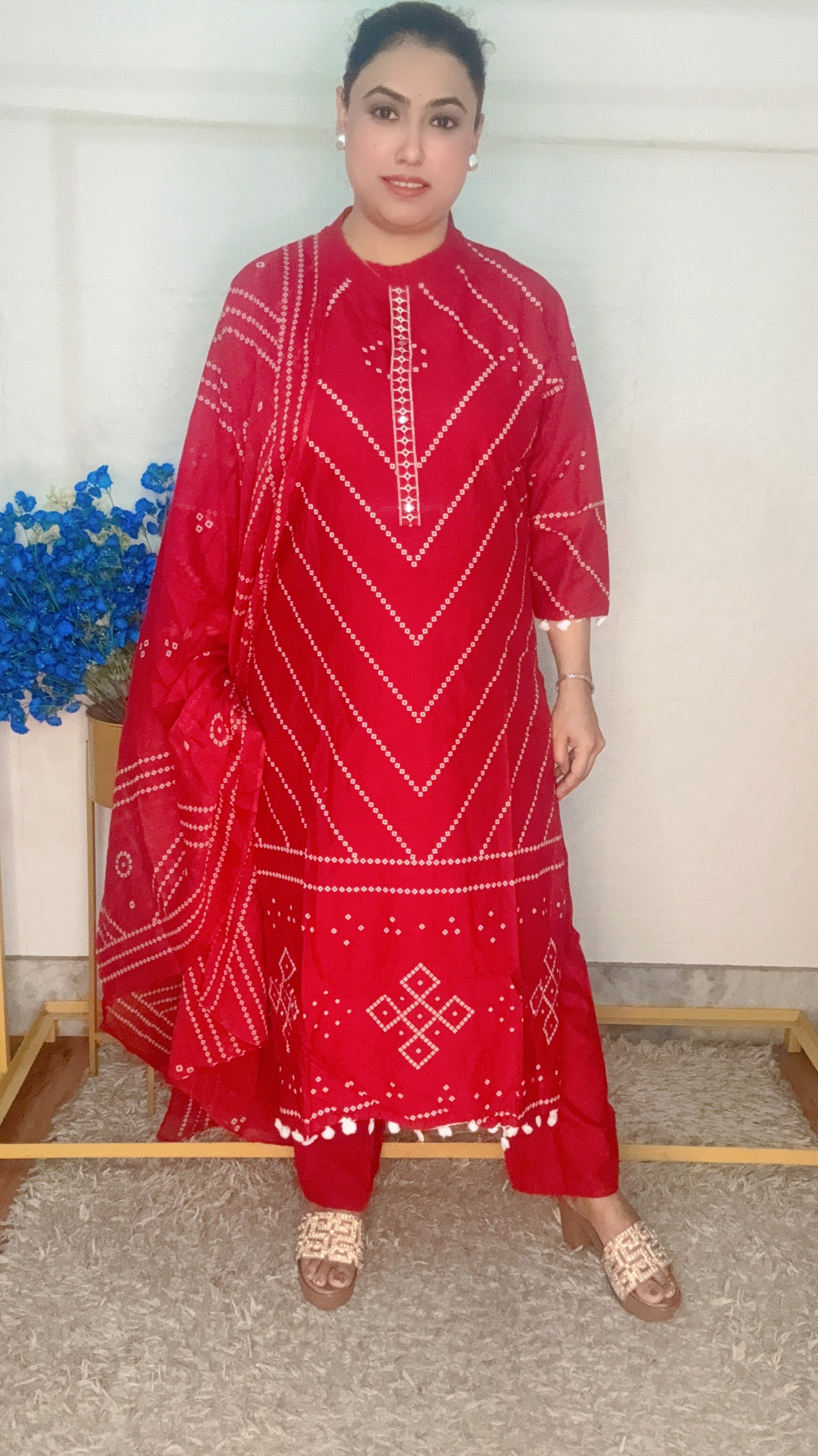Red bandhini printed with pom pom work suit set