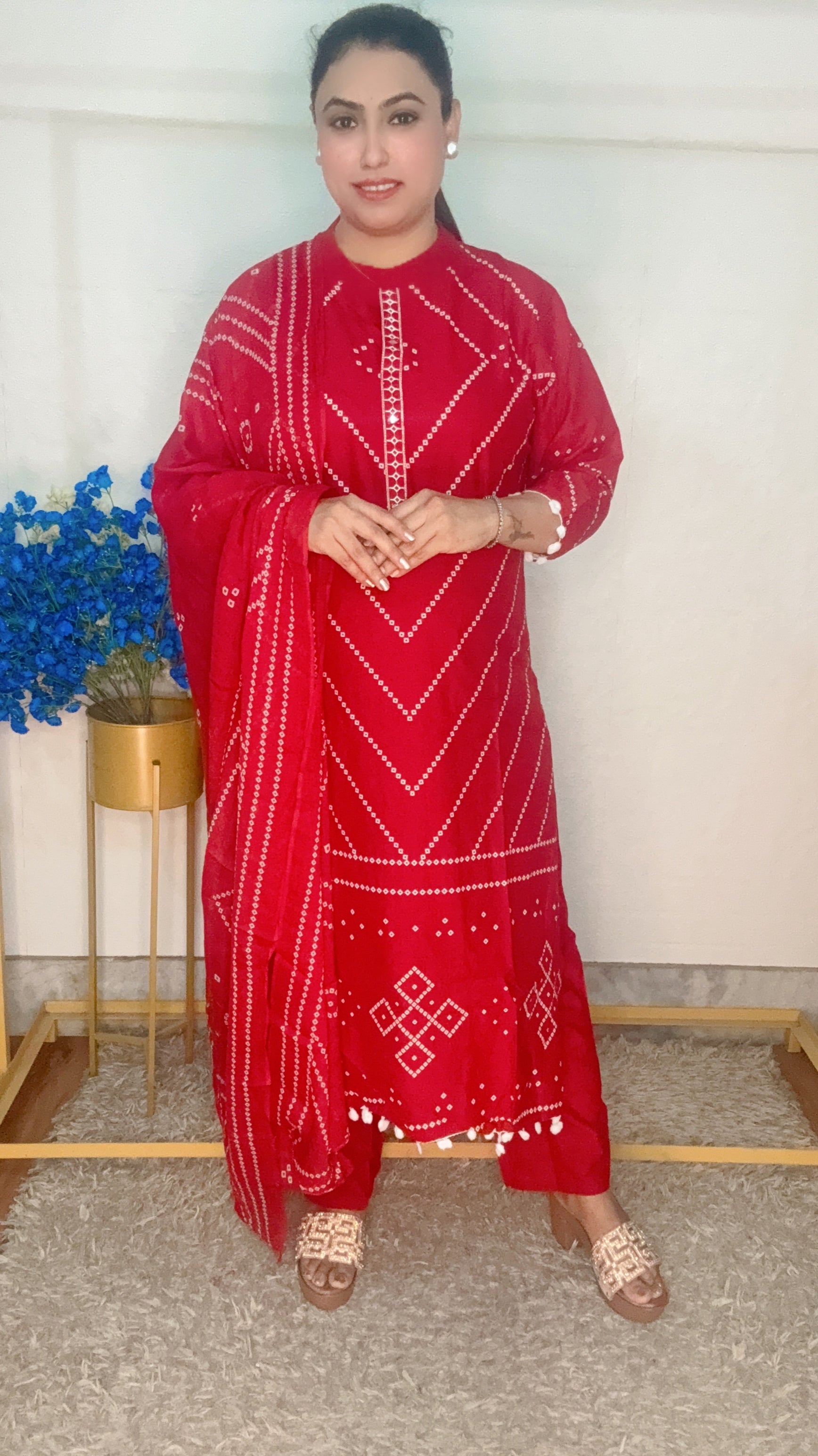 Red bandhini printed with pom pom work suit set