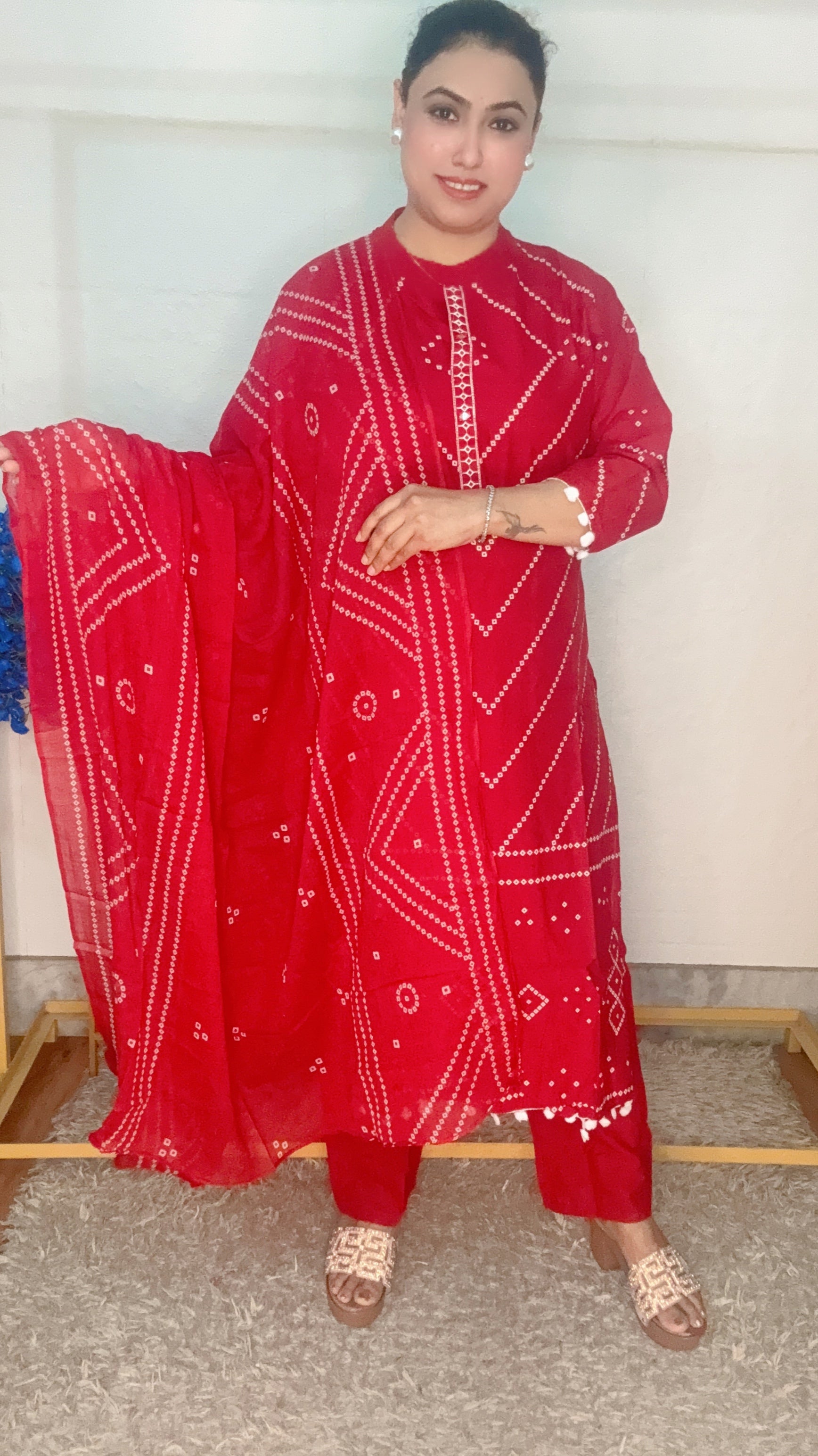 Red bandhini printed with pom pom work suit set